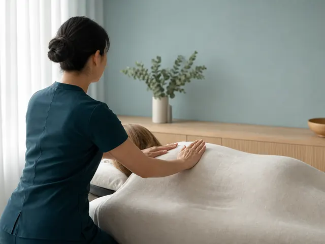Therapist using gentle flowing palm movements during a fully covered Swedish relaxation massage